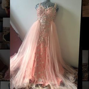 A very elegant dress with a long tail